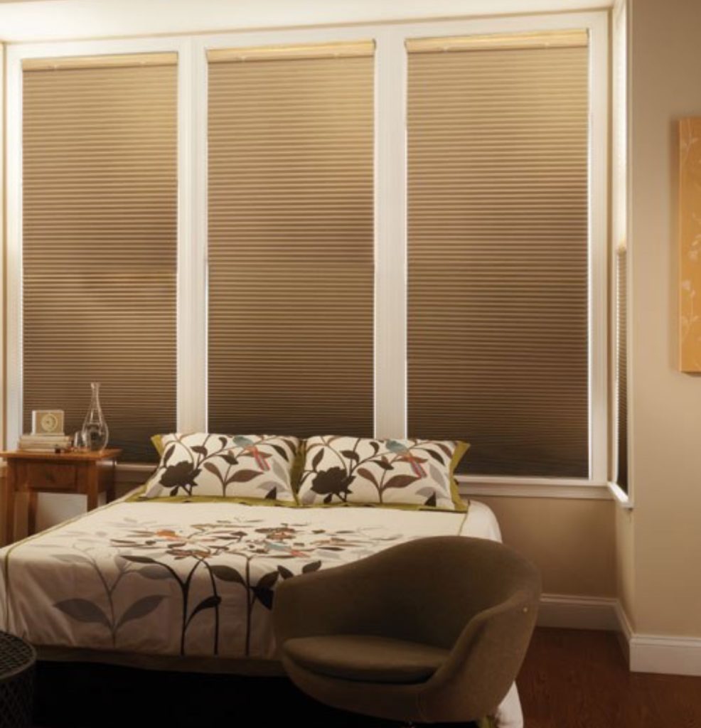 Roller shades installed on bedroom windows, made from nfpa 701 flame retardant material